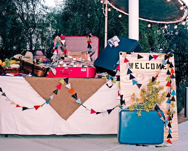 Set up a welcome sign and vintage suitcases to greet your wearied travelers